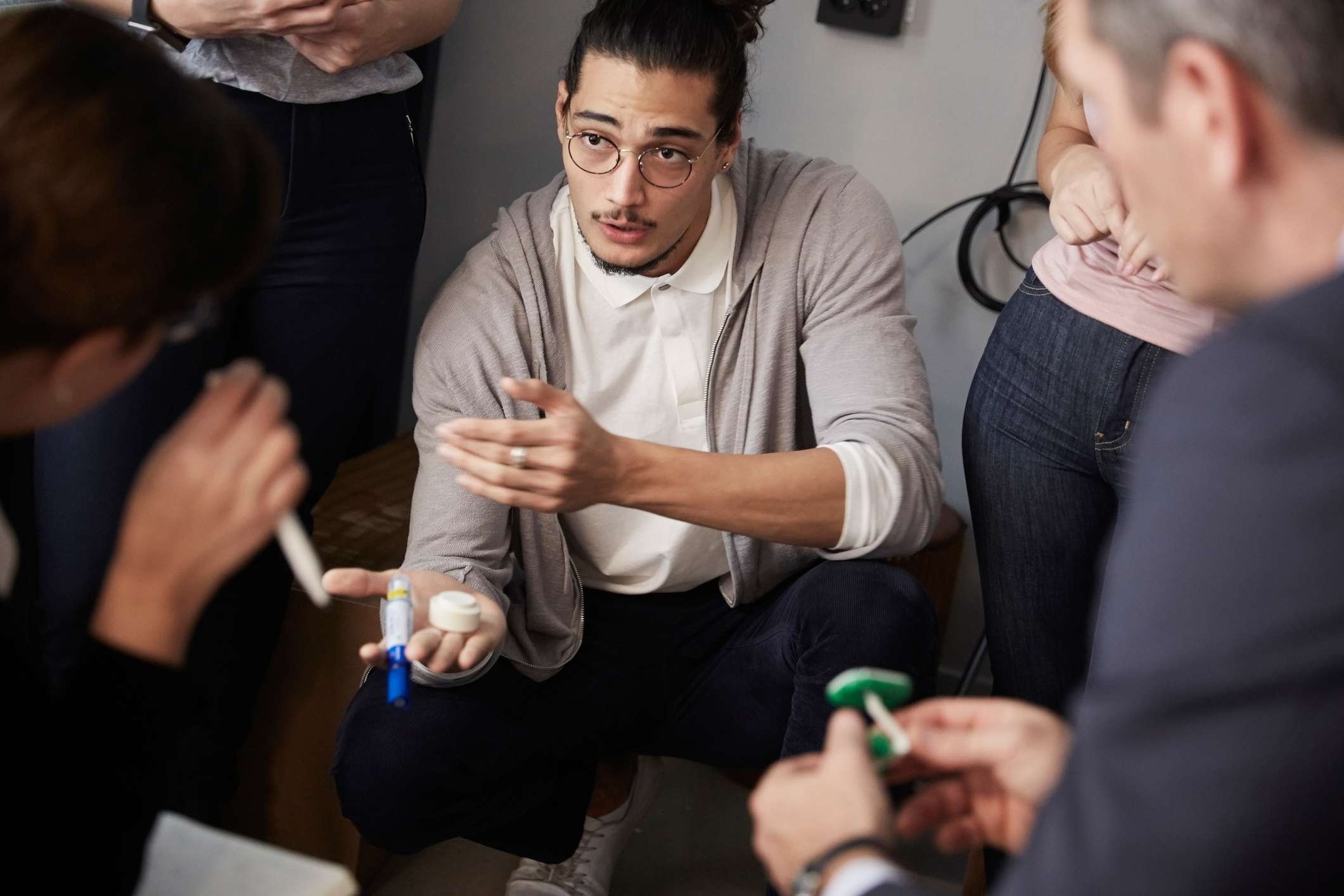 a man talking in a group of people