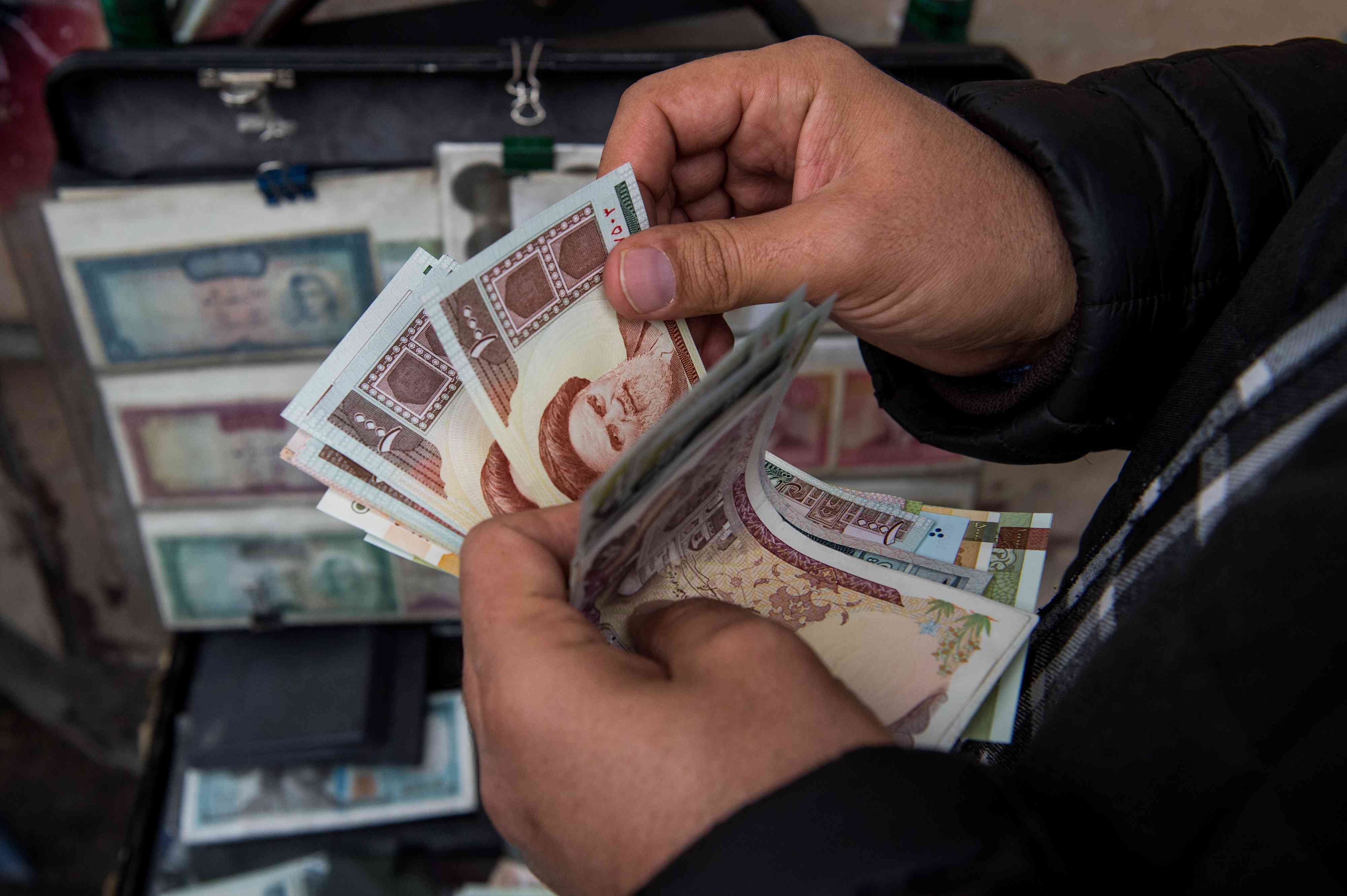 Iran banknotes - a local fiat currency that might get affected by crypto adoption - at a money exchange market.