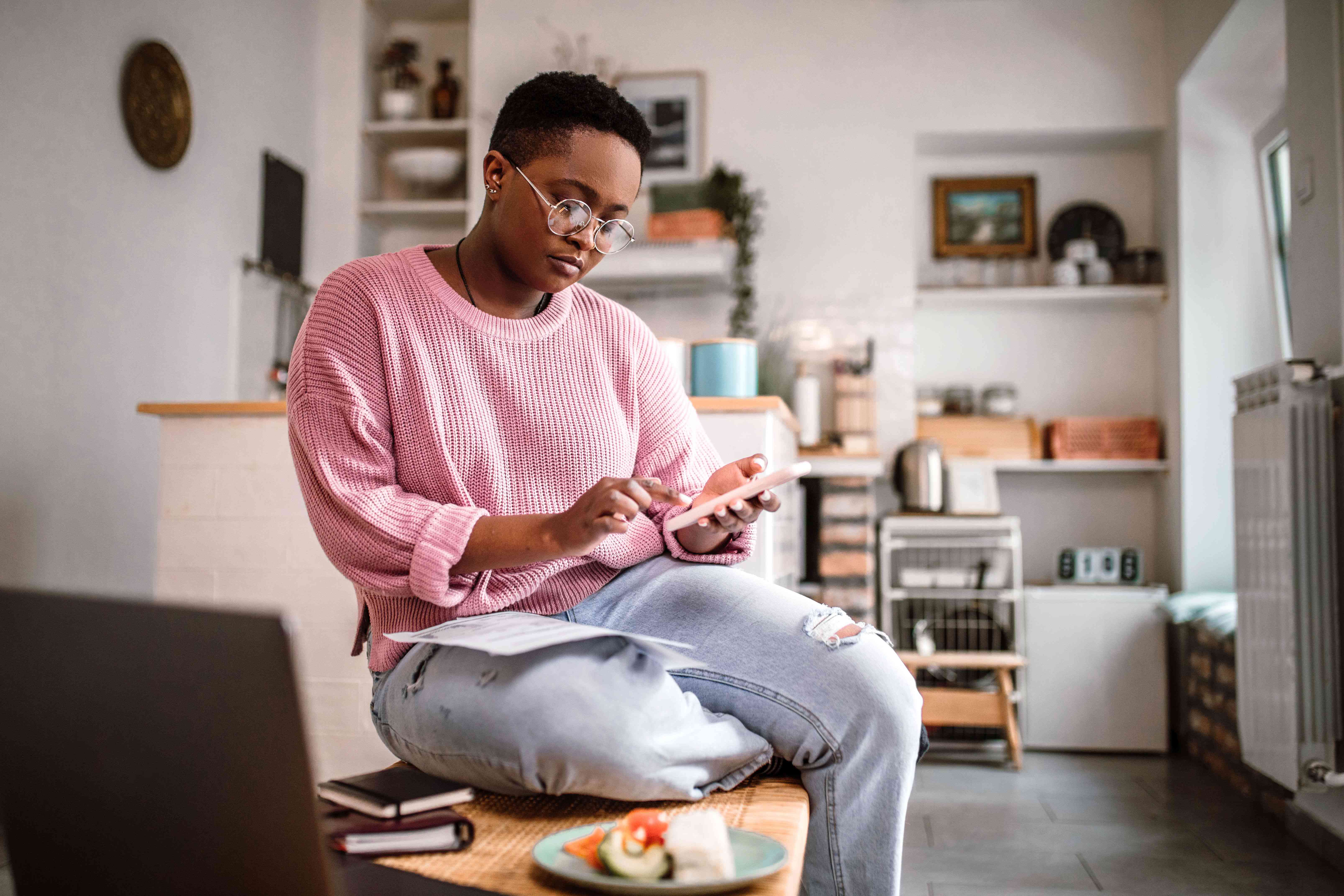 Person using a smartphone at home