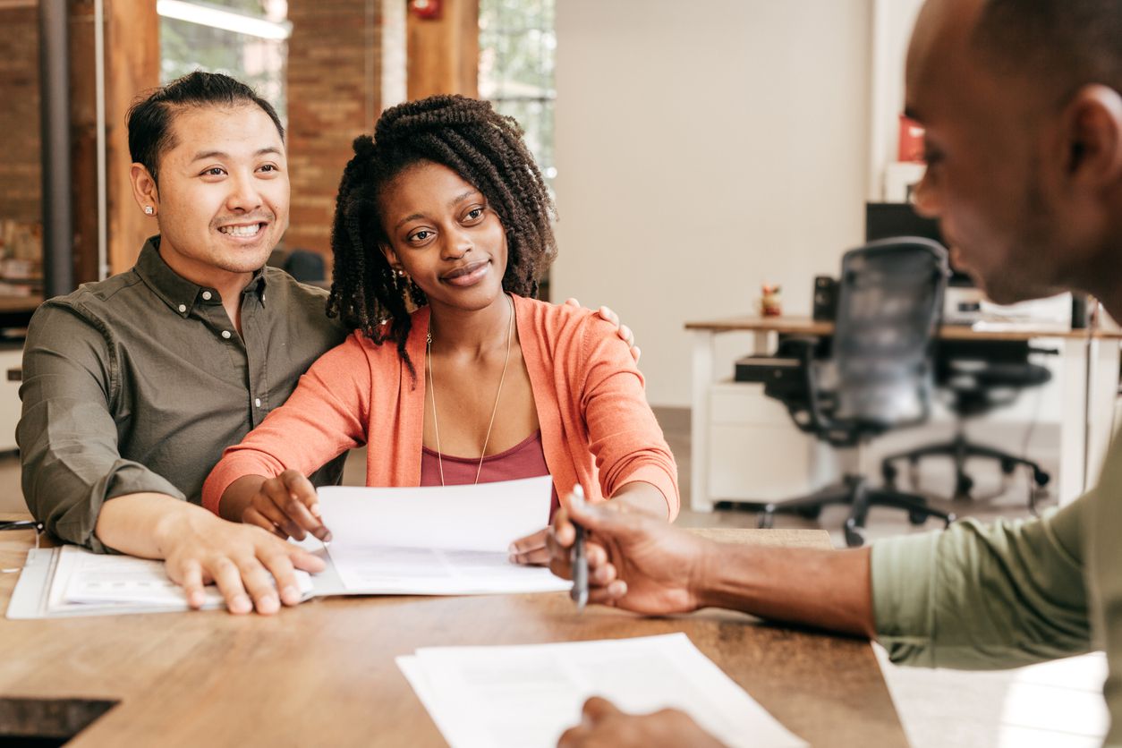 Couple getting a loan from a bank officer