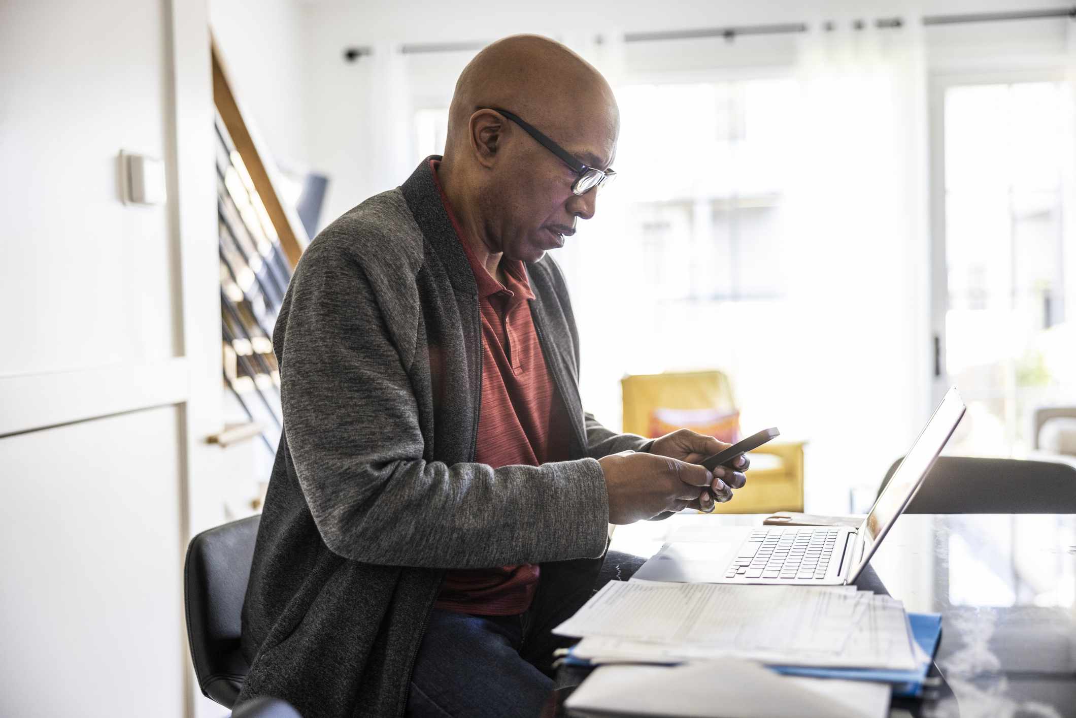 A man uses a smartphone.